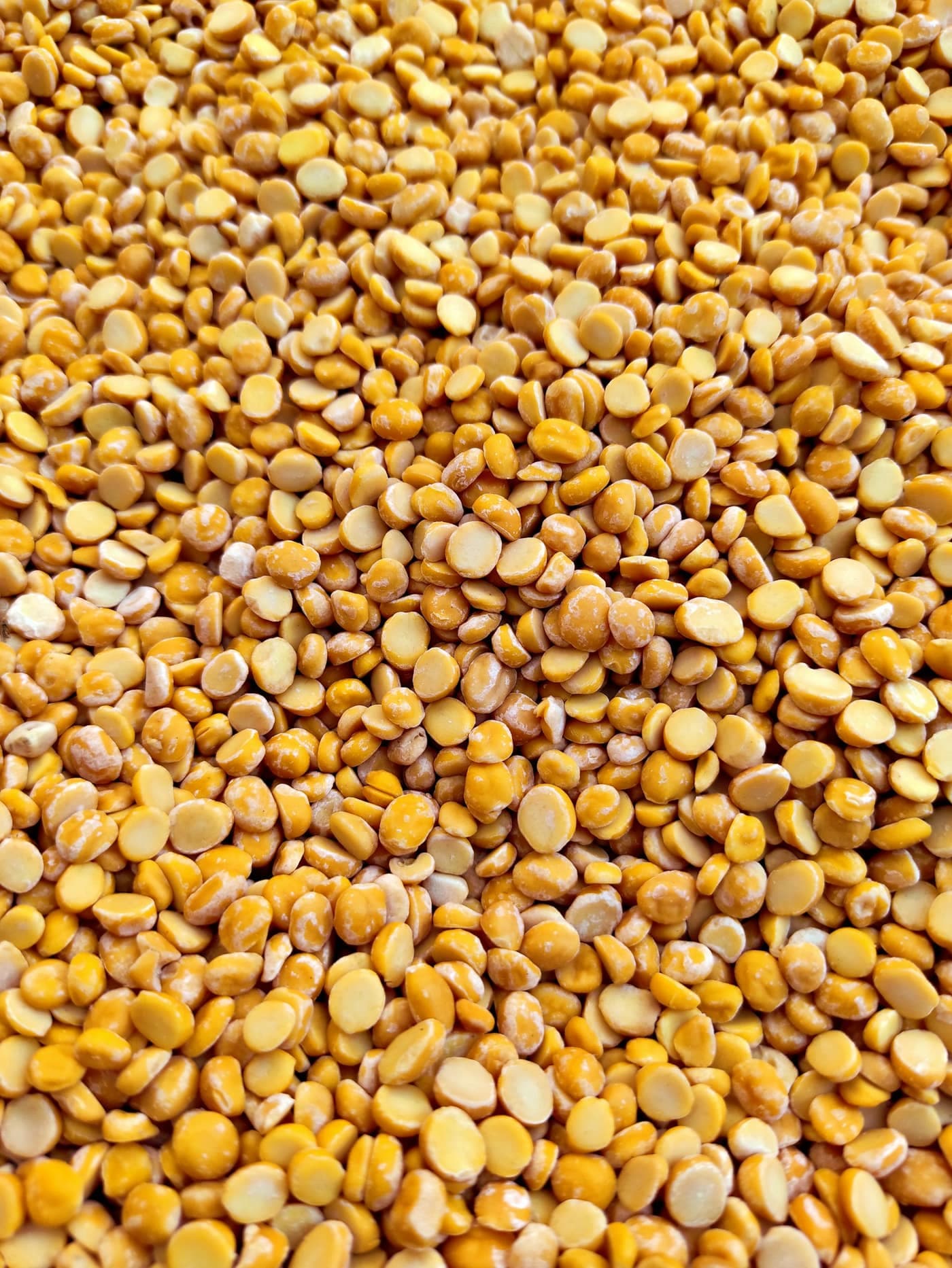 A heap of split, golden-orange arhar (tur) dal lentils