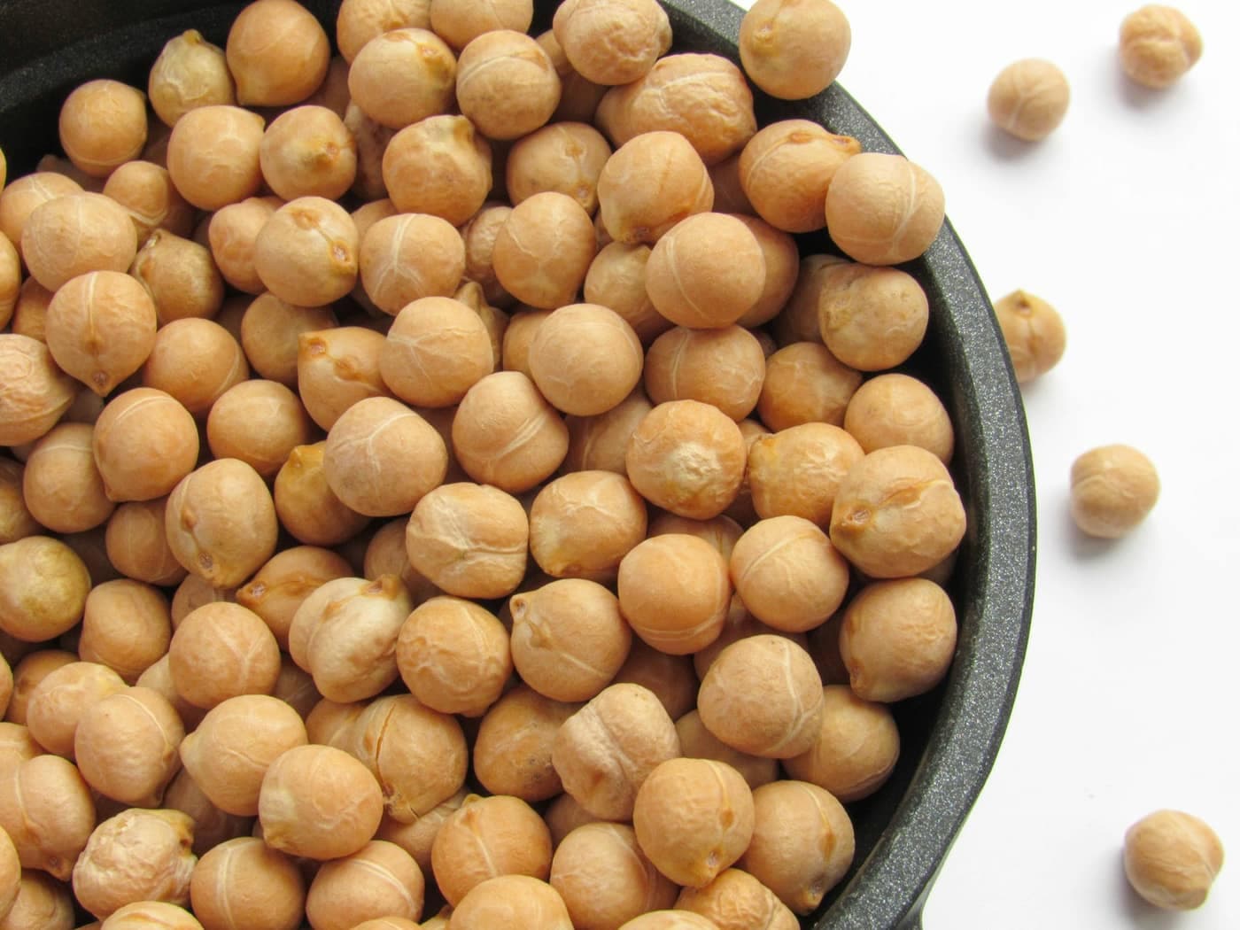 Chickpeas (chana) piled in a dark cooking pot